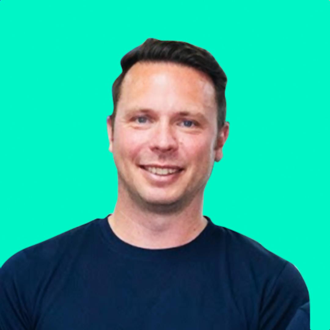 A smiling photo of Matt Biset on a solid turquois background