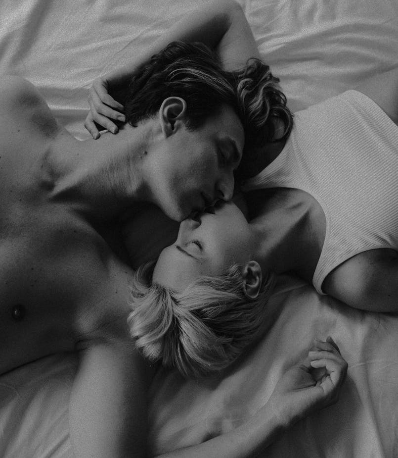 A loving couple caressing one another