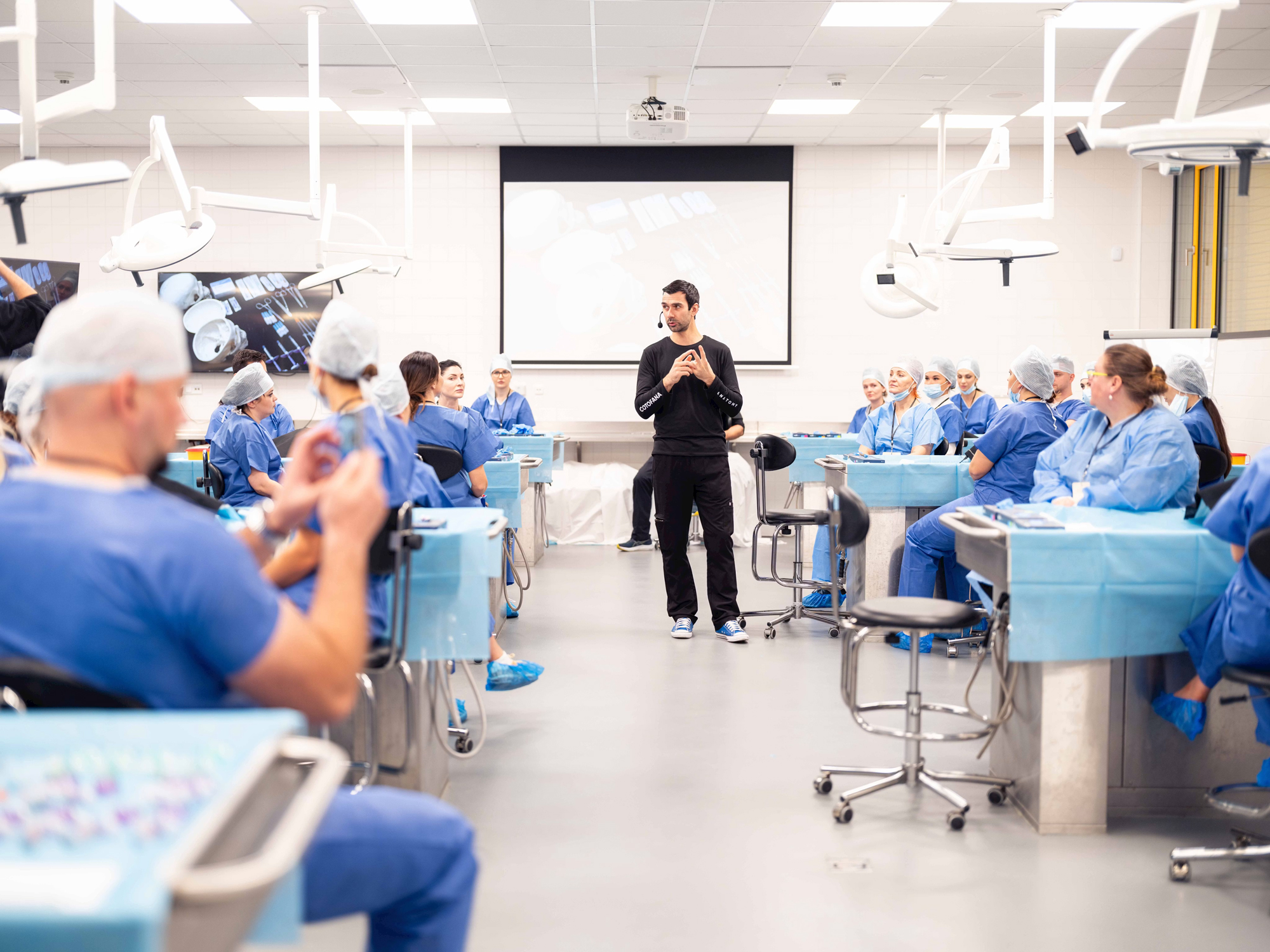 Professor Cotofana conducting a live cadaver session with students