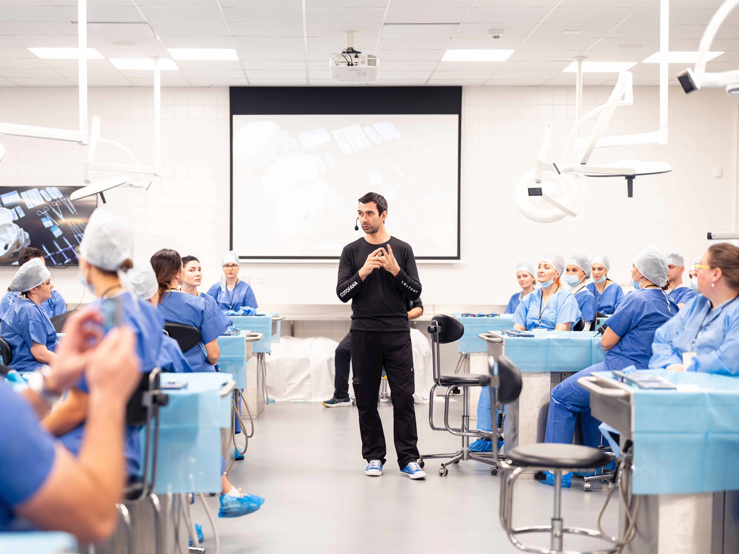 Professor Cotofana conducting a live cadaver session with students