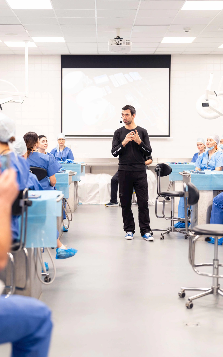 Professor Cotofana conducting a live cadaver session with students