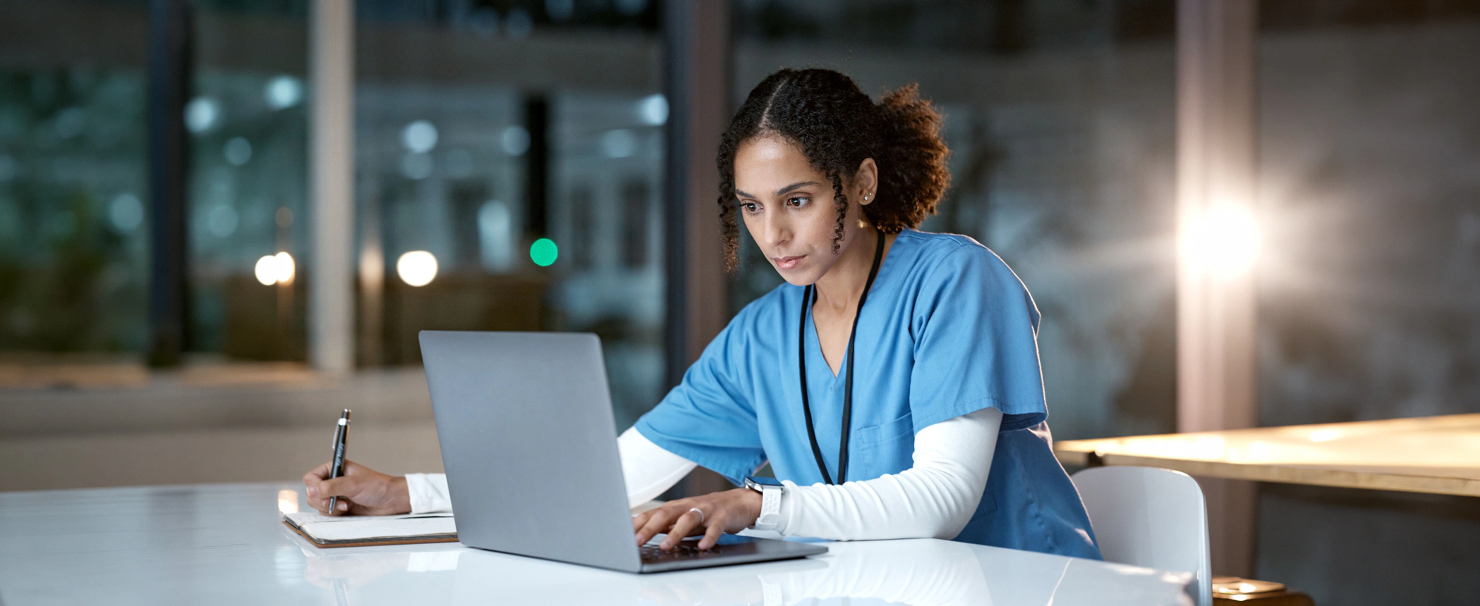 female medical professional using her laptop device