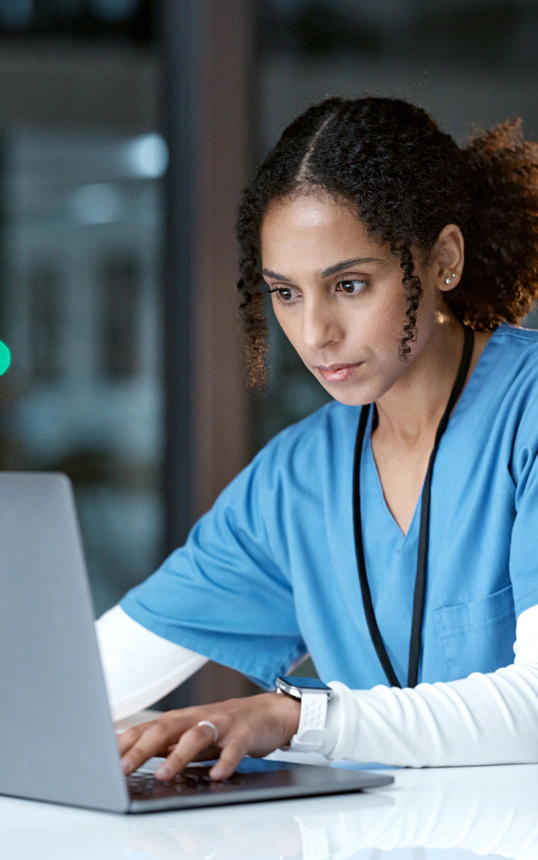 female medical professional using her laptop device