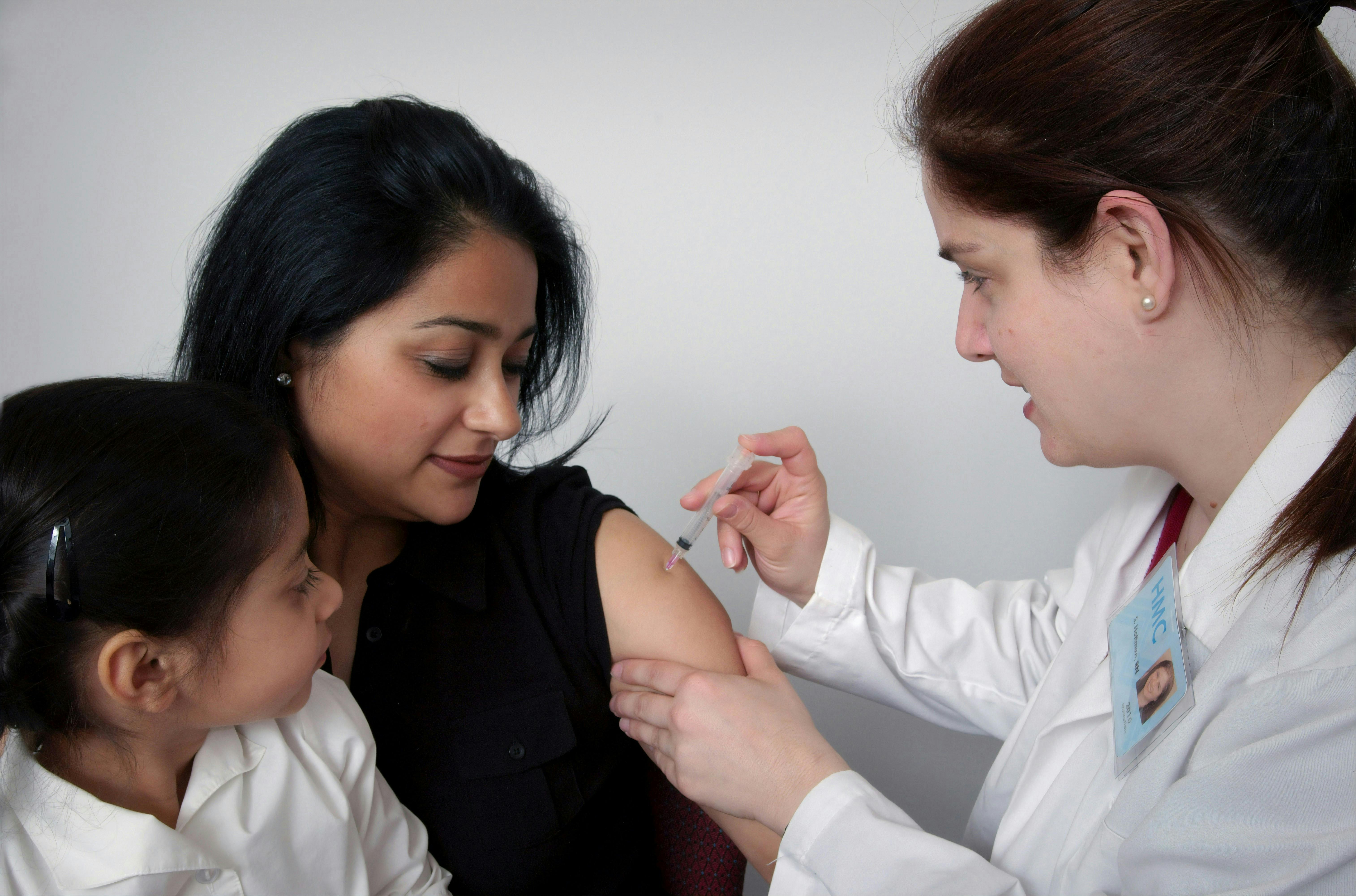 Doctor administering a vaccine
