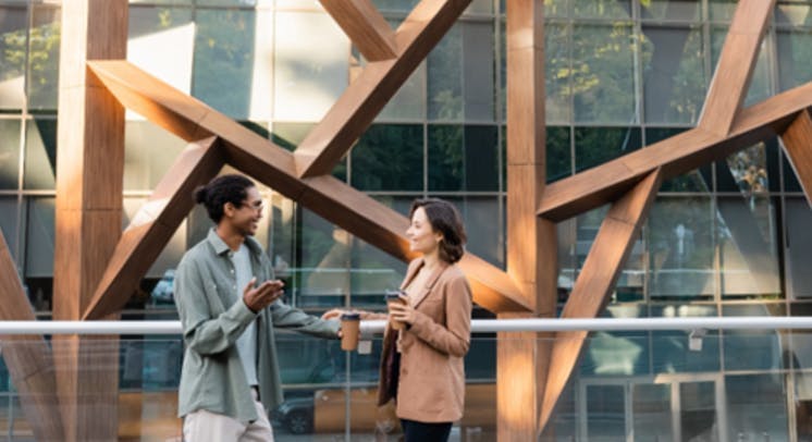 Architects enjoying coffee in a modern building. Designing for Daylight and Comfort 