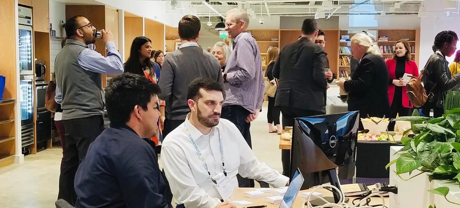 group of AEC professionals networking in a room