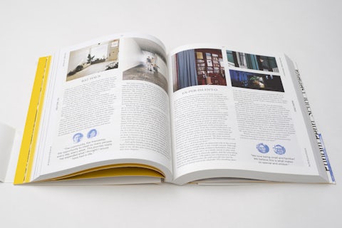 Page spread of 'Around the World in 250 Coworking Spaces' with text and images showcasing different workspaces.