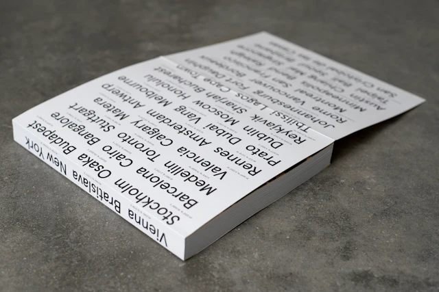 Back cover featuring city names with coordinates