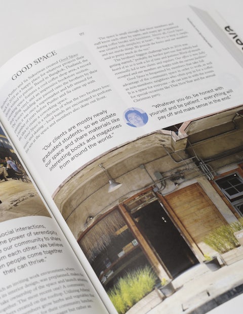 Open book page featuring an article titled 'GOOD SPACE' next to an image of its rustic coworking area entrance.
