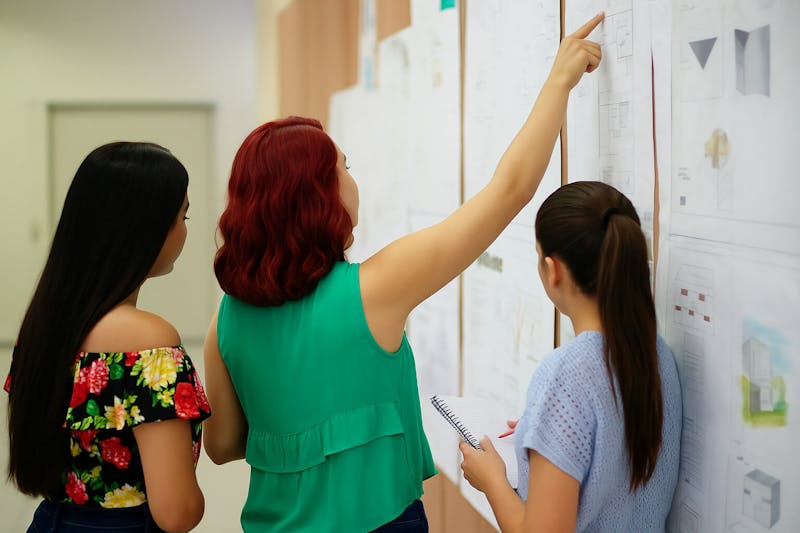 University workshop with coworking professionals teaching students about workspace management