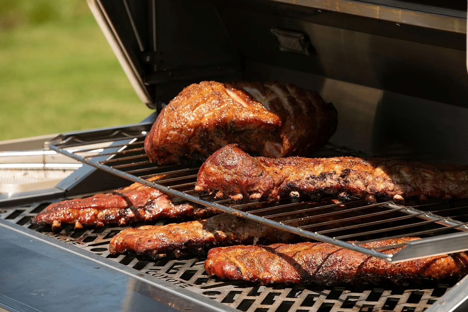 ribs being cooked on coyote grill