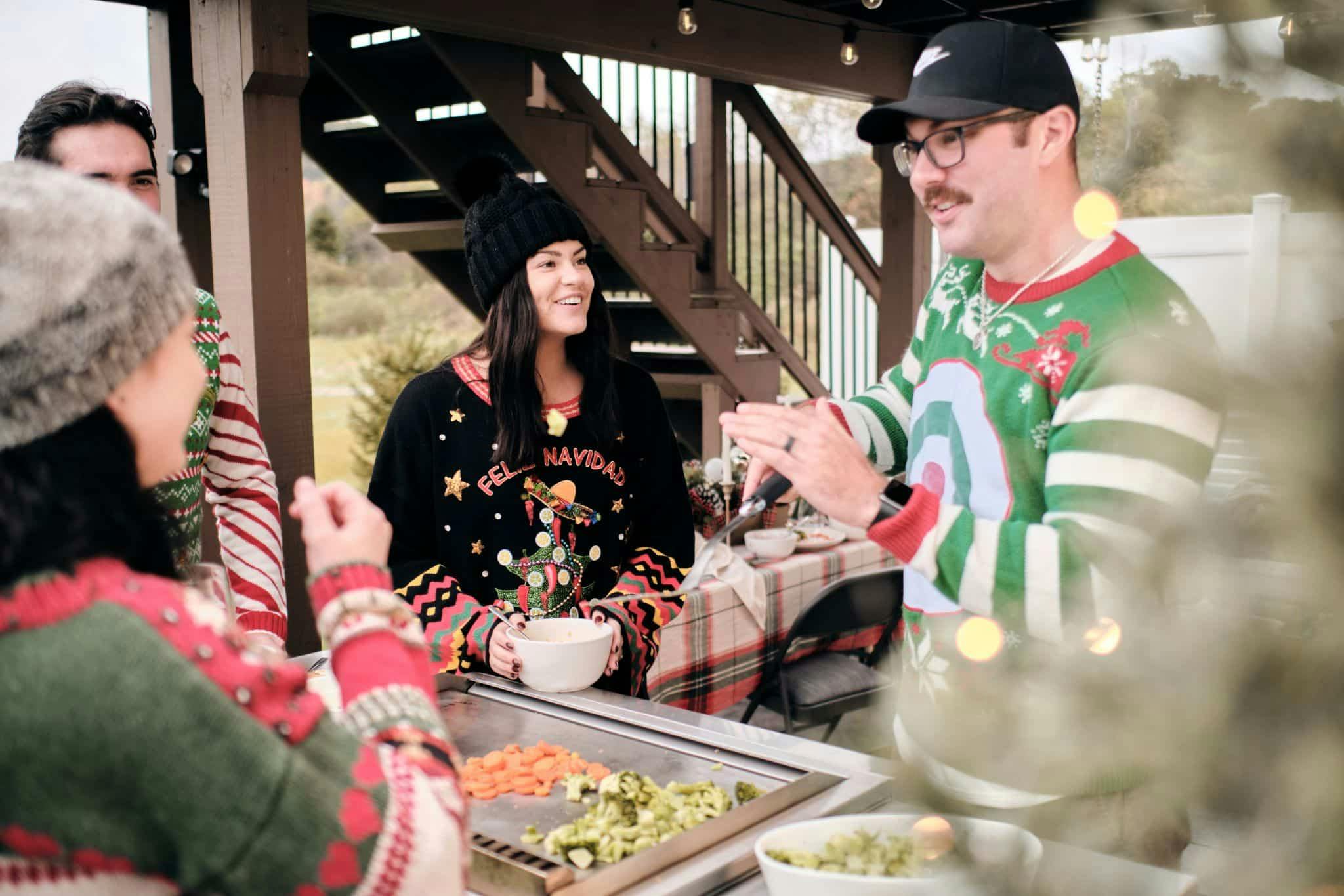 family enjoying meal cooked on coyote grill