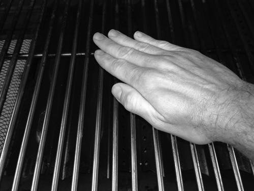 hand over grill