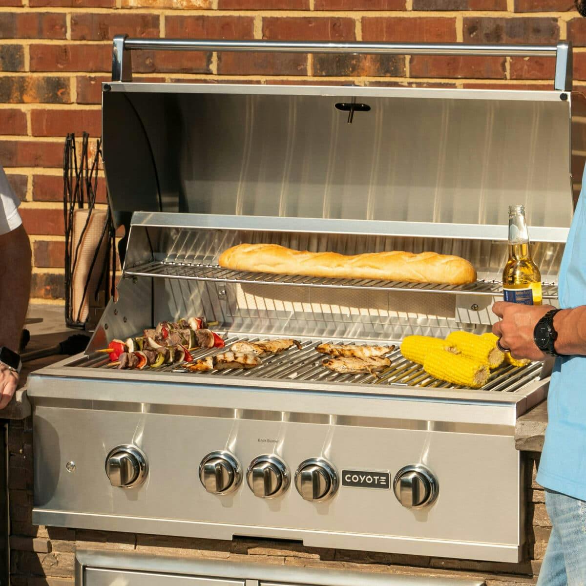 Chicken, skewers and cob on a Coyote Outdoor grill
