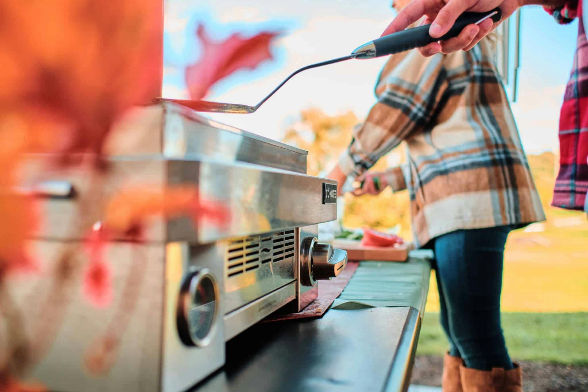 couple grilling on portable grill