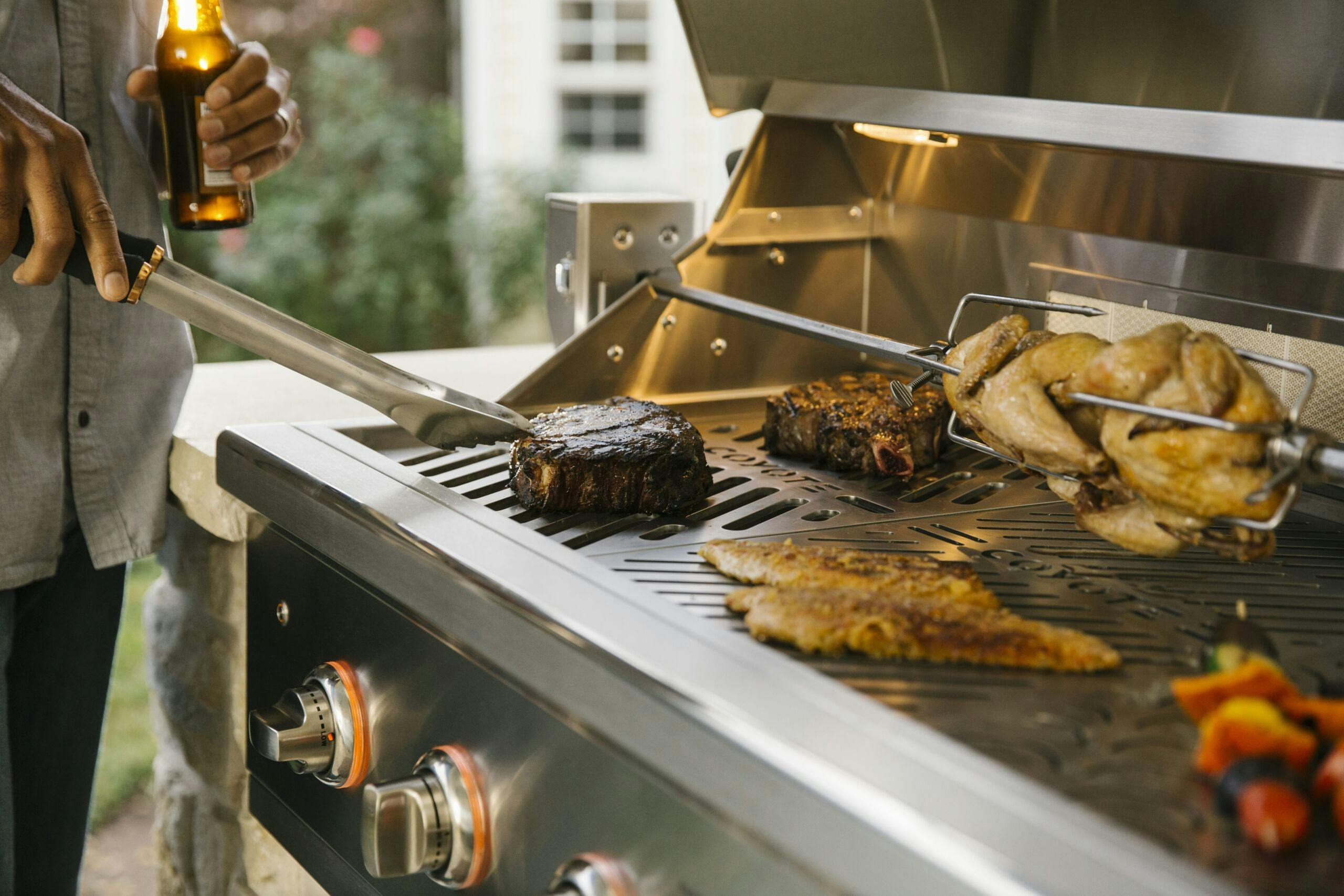 steak being grilled on coyote grill