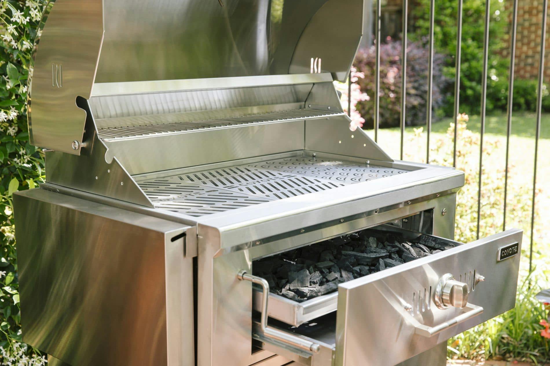 coyote charcoal grill on a cart