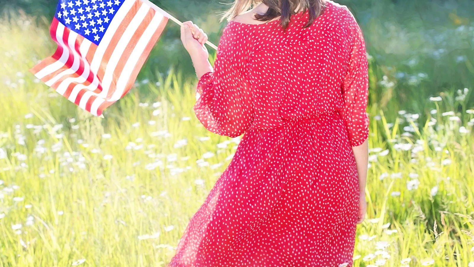Girl holding American flag.
