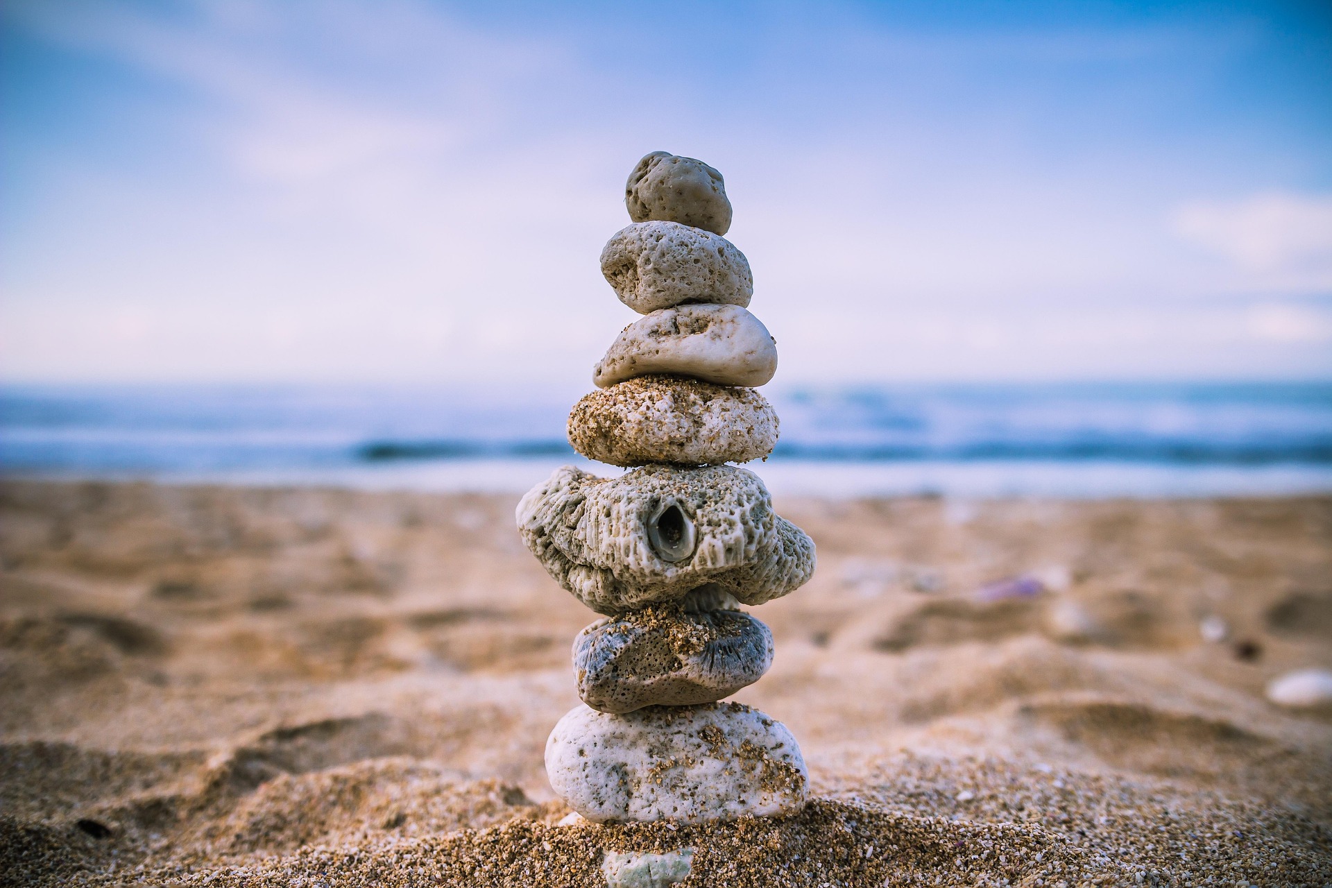 Stacked stones on a beach.