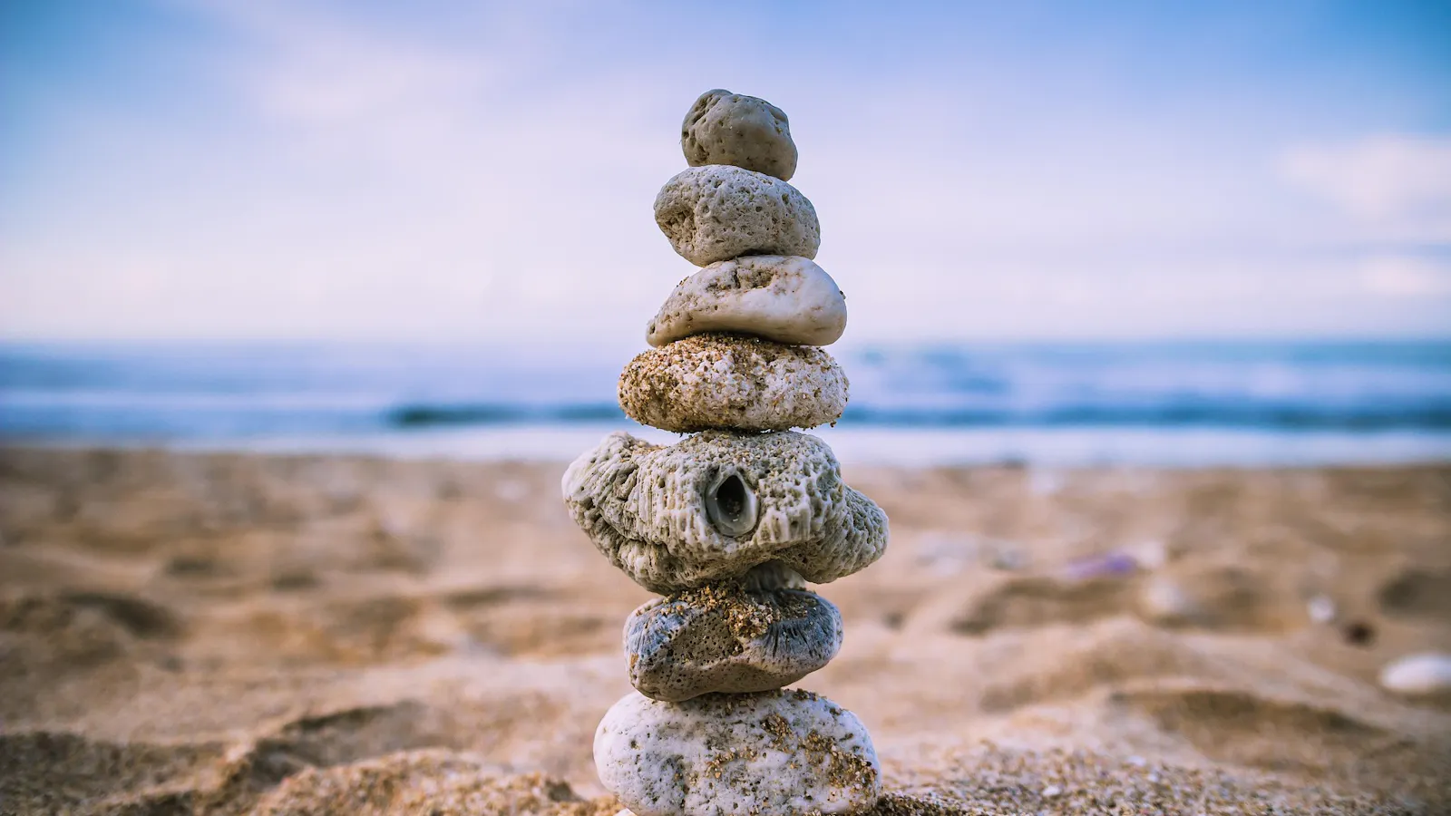 Stacked stones on a beach.