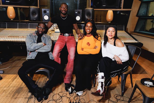 Ayamé, Sarel, Victor Kunda and Specs Gonzalez smiling in a studio.