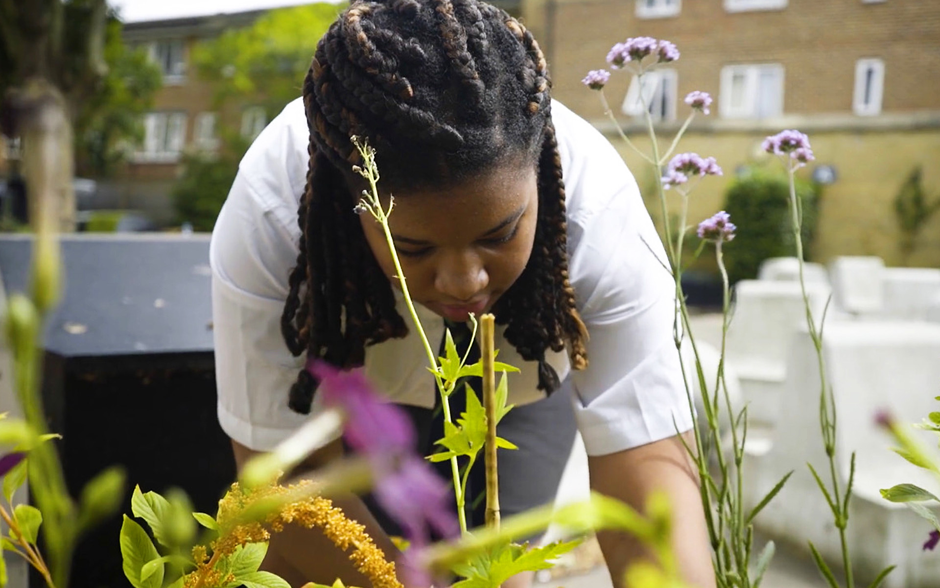 a female student planting flowers