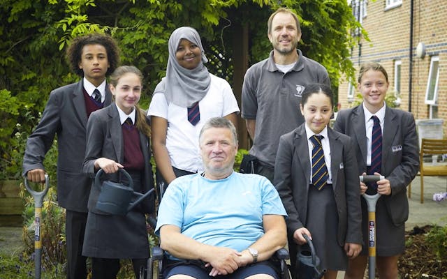 a group of students with male day centre resident