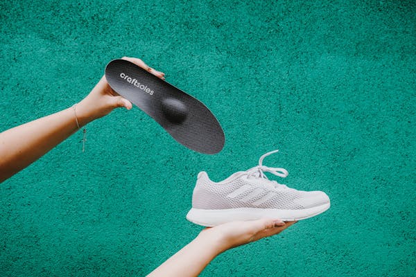 Banner grün Schuh und Einlage