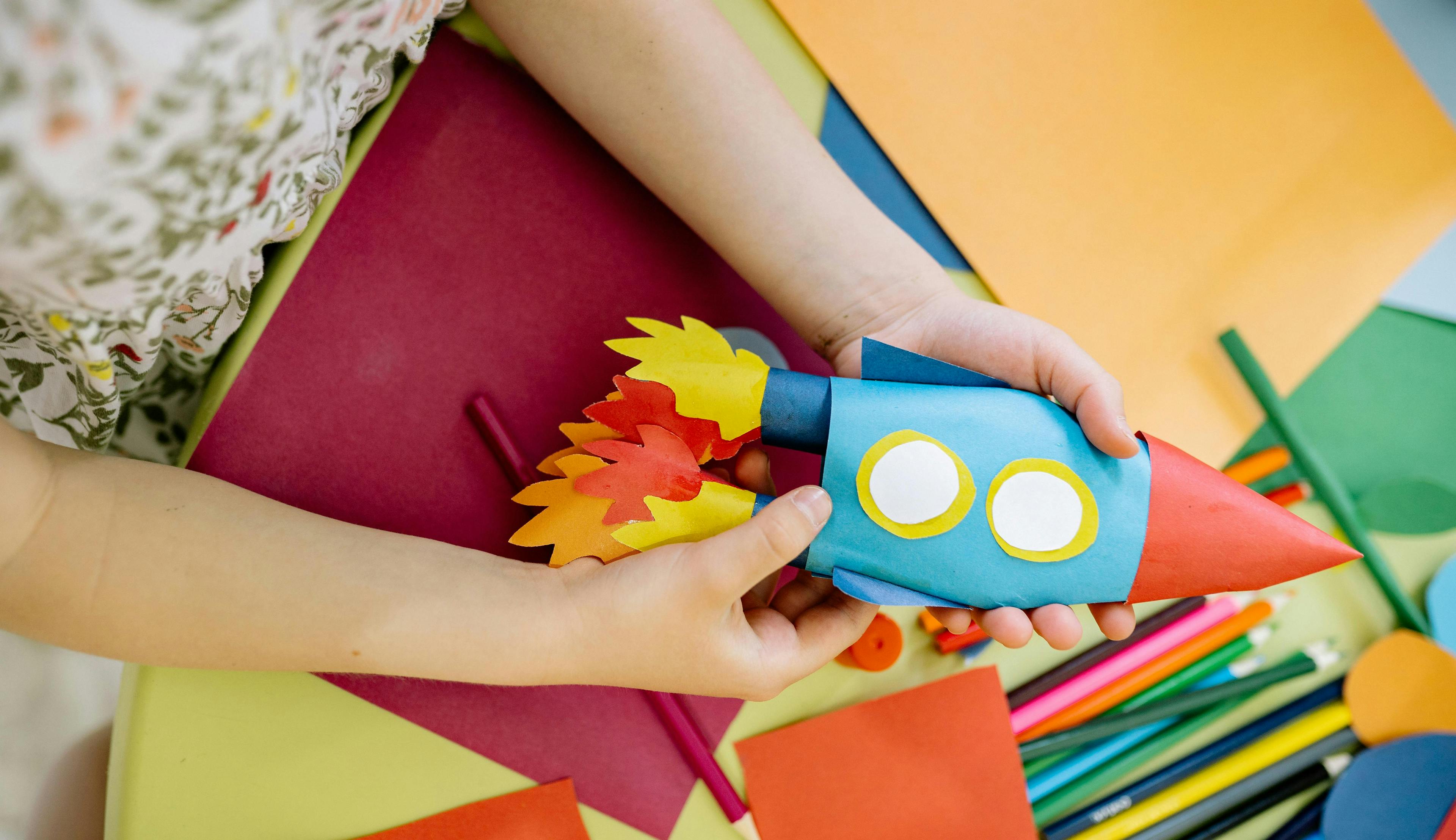 Kid with paper rocket