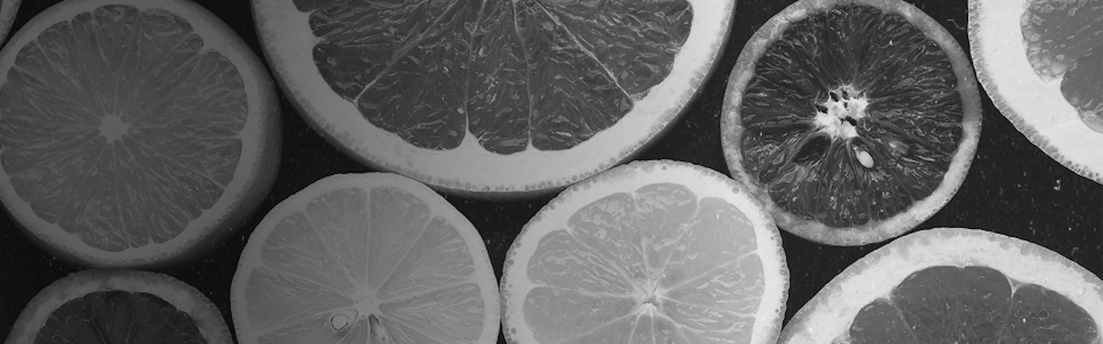 Freshly sliced lemons and grapefruits representing citrus-rich terpenes like limonene found in uplifting cannabis strains