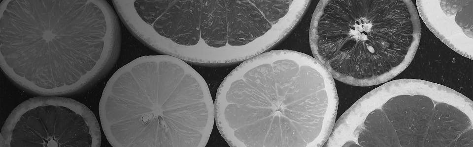 Freshly sliced lemons and grapefruits representing citrus-rich terpenes like limonene found in uplifting cannabis strains