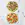Two pizzas shot overhead, one is topped with Pesto, Prosciutto & Goats Cheese, the other with tomatoes, mozzarella and fresh basil.