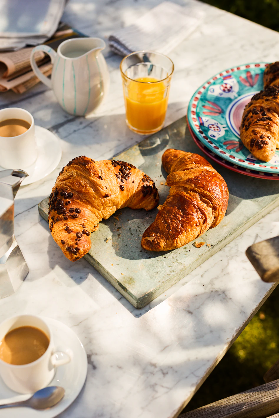 Chocolate & Hazelnut Cornetti on a plate at a breakfast spread.