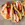 Three mini piadina on a rack, filled with lettuce, grilled vegetables, chicken and yoghurt.