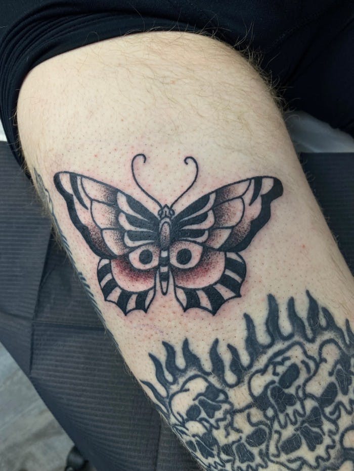 Tattoo of a traditional butterfly.