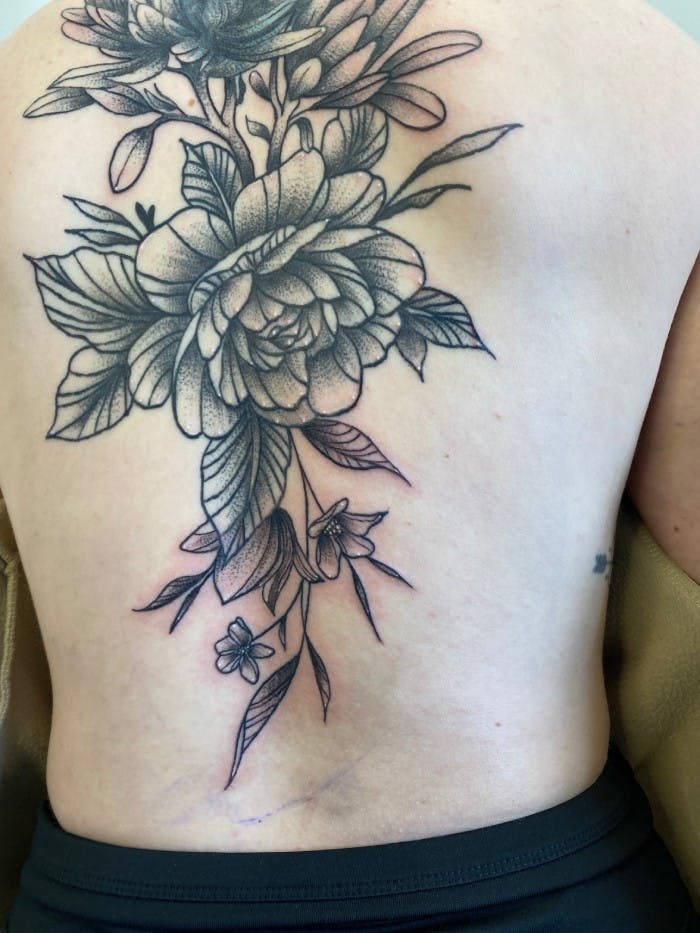 Tattoo of a large floral back piece.