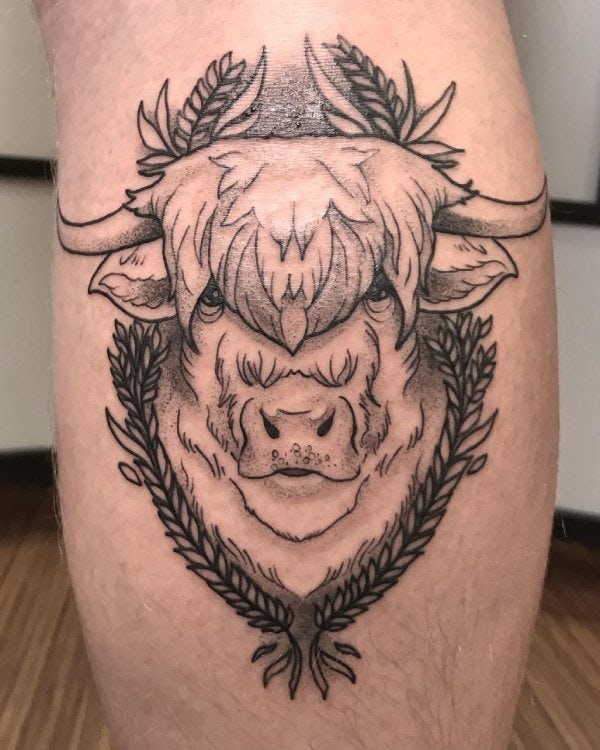 Tattoo of a fluffy bison face created by Ilya.
