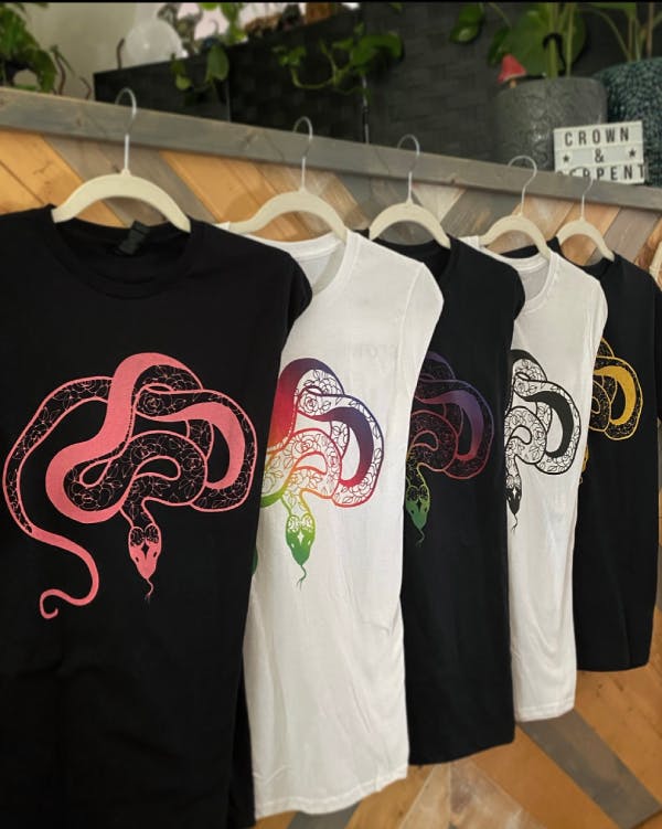 Row of t-shirts with different colored C&S logos.