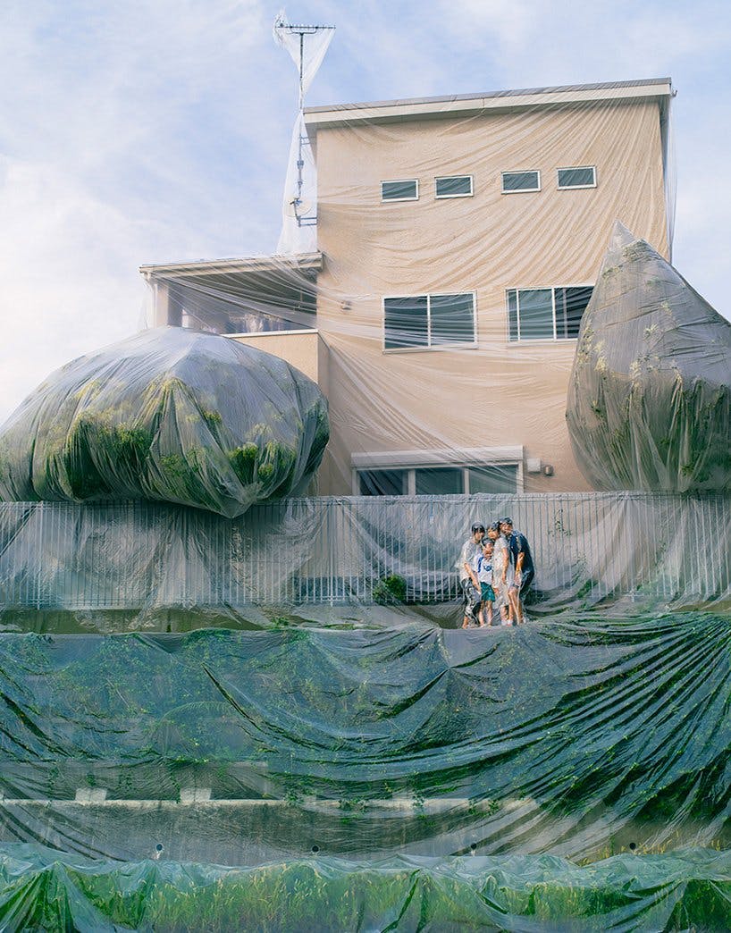 Photographer Hal vacuum-seals families together with their homes.
