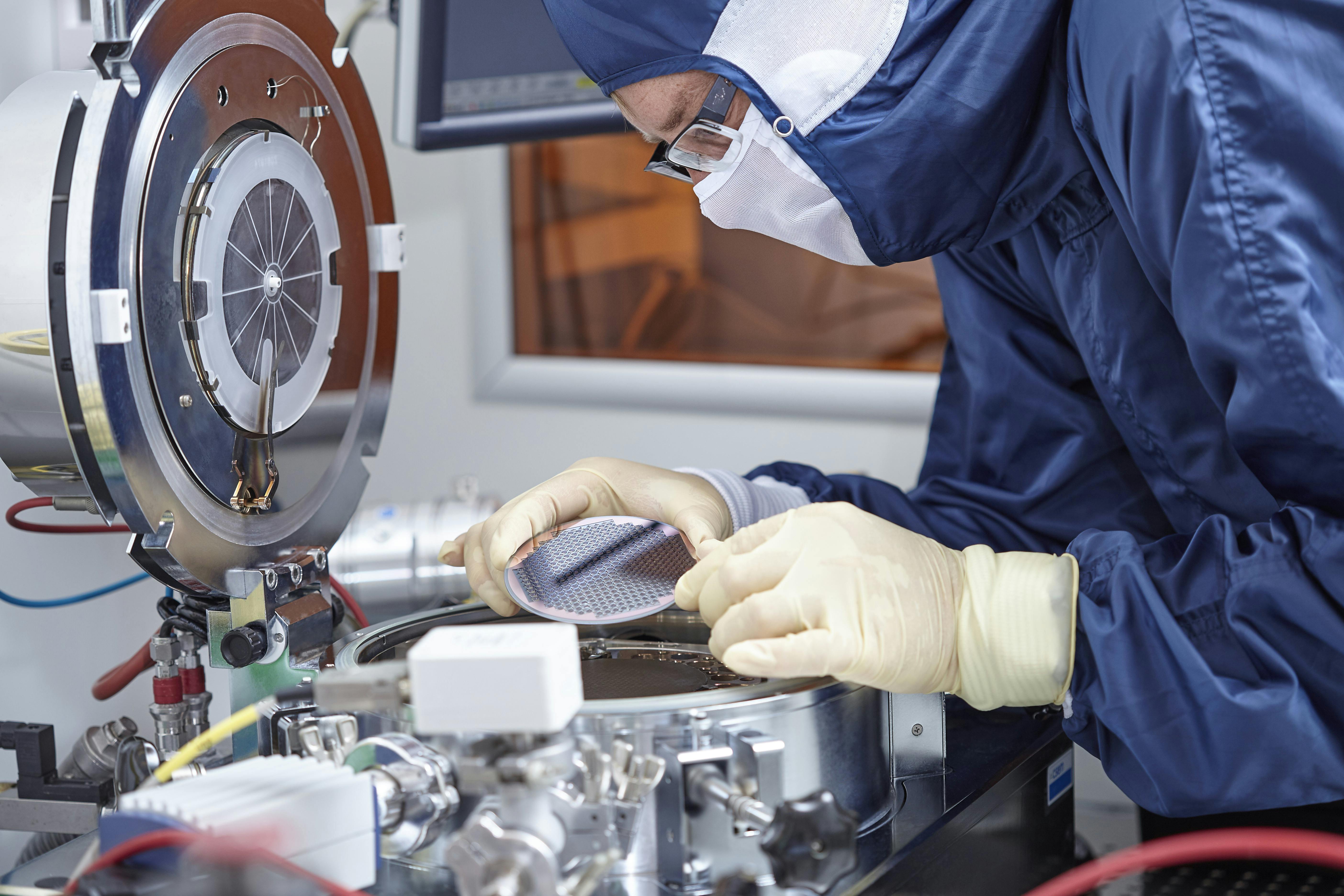 A scientist using a 4x4x1.9 mm³ Rb vapor cell.