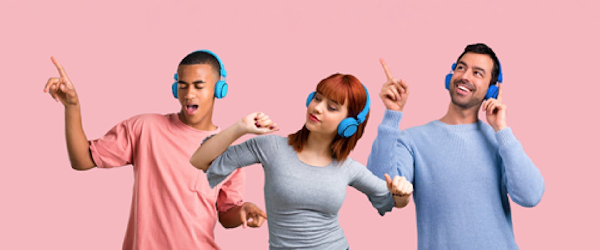 Young people listening to music with headphones