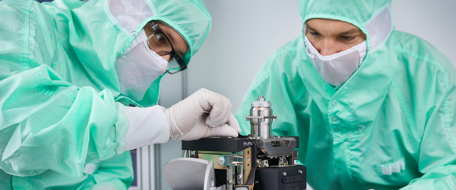 Two scientists in a clean room