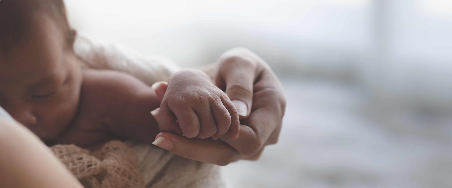 Mum holding her new born baby