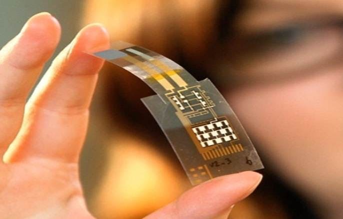 Woman holding a flexible sensor surface