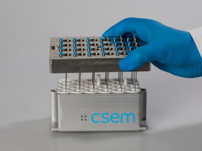 Hand holding a 24-channel labware