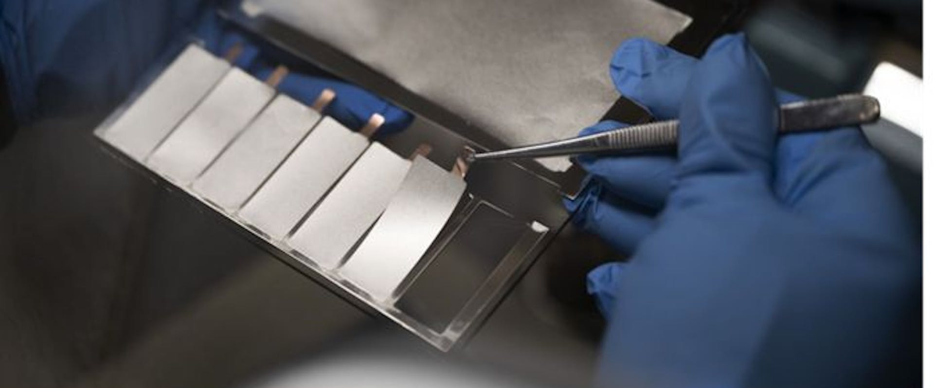 A CSEM expert carefully unloads thin-film Li-metal anodes, deposited via thermal evaporation, onto a Cu current collector.