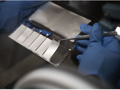 A CSEM expert carefully unloads thin-film Li-metal anodes, deposited via thermal evaporation, onto a Cu current collector.