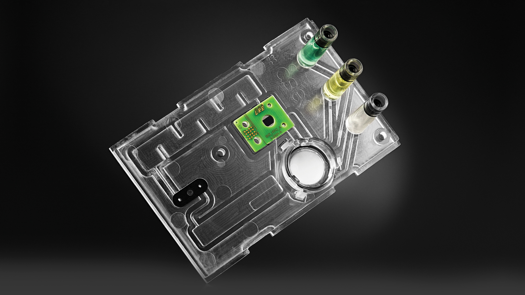 BioCDX, the biophotonic diagnostics device with a disposable microfluidic cartridge.