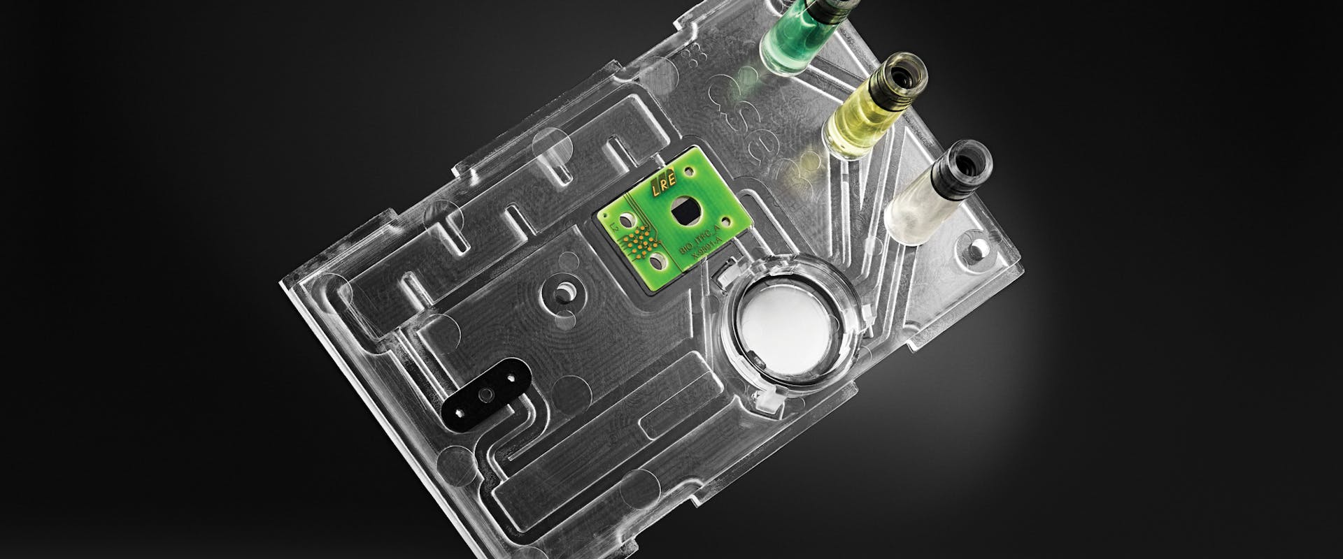 BioCDX, the biophotonic diagnostics device with a disposable microfluidic cartridge.