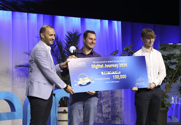 Bahaa Roustom, VP Marketing & Business Development at CSEM (left), presents the main prize of the 'CSEM Digital Journey 2024' competition to the Varioprint AG team, which was awarded a grant of 100,000 Swiss francs for its innovative PCB inspection solution.
